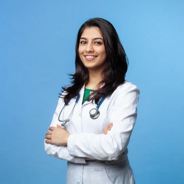Dr. Sushmita Bhattarai in a white clinical coat, a stethoscope around her neck
